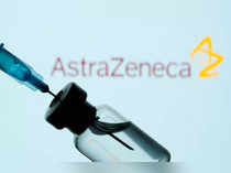 FILE PHOTO: FILE PHOTO: Vial and sryinge are seen in front of displayed AstraZeneca logo