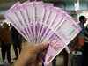 Rupee gains 10 paise to close at 72.87 against US dollar