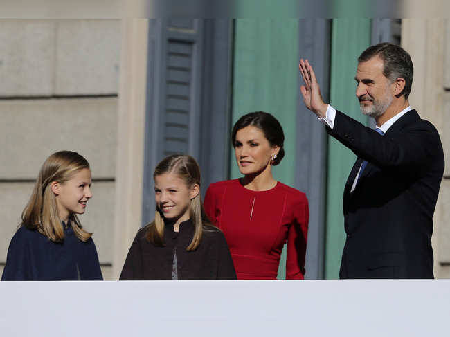 File photo of December 2018: Spain's King Felipe VI and his wife Queen Letizia wave to the crowd with their daughters Princess Leonor, left, and Princess Sofia during celebrations of the 40th anniversary of the Spanish Constitution at the Spanish parliament, in Madrid, Spain.
