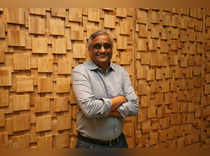 FILE PHOTO: Kishore Biyani, CEO and founder of India's Future Group poses after the inauguration of Foodhall, a premium lifestyle food superstore by the Future Group, store in Mumbai