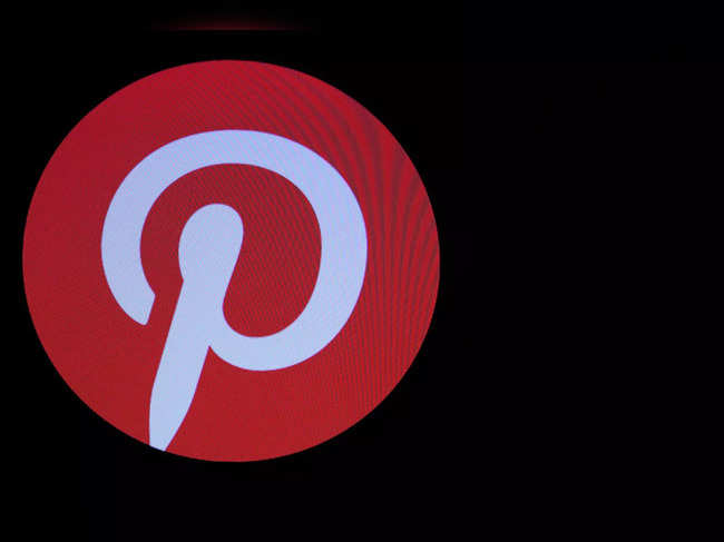 Screens display the company logo for Pinterest Inc. during the company's IPO on the front of the NYSE in New York