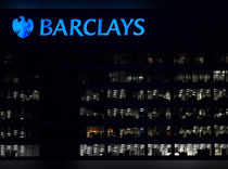 FILE PHOTO: Workers are seen at Barclays bank offices in the Canary Wharf financial district in London