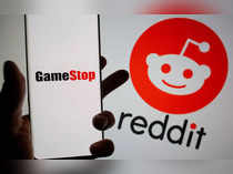 FILE PHOTO: FILE PHOTO: GameStop logo is seen in front of displayed Reddit logo in this illustration