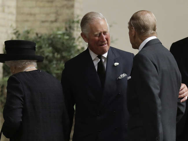 File photo of June 2017: Prince Philip (L), Duke of Edinburgh, is greeted by Prince Charles (C), Prince of Wales, as they arrive for the funeral service of Patricia Knatchbull, Countess Mountbatten of Burma at St Paul's Church in Knightsbridge in London, England.