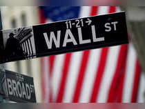 FILE PHOTO: A Wall Street sign is pictured outside the New York Stock Exchange, in New York City, U.S.