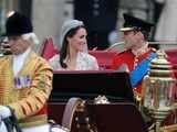 William and Kate travel in a carriage to Buckingham Palace