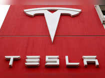 FILE PHOTO: A Tesla sign at the carmaker's branch office in Bern, Switzerland