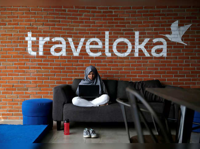 FILE PHOTO: FILE PHOTO: An employee of Traveloka works at the company's headquarters in Jakarta