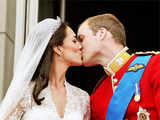 Prince William and his wife Catherine, Duchess of Cambridge kiss on the balcony of Buckingham Palace