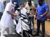 Watch: Mamata Banerjee nearly falls while driving electric scooter to protest fuel price hike