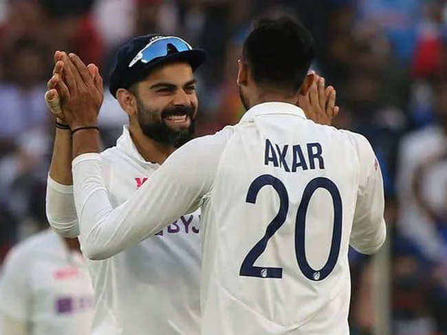 Virat Kohli and Axar Patel ​celebrate the dismissal during the 2nd day of the 3rd Test Match in the series between India and England at Narendra Modi Stadium, Motera in Ahmedabad on Thursday. (Image: Twitter/Virat Kohli)