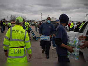 Volunteers give water to residents affectred by unprecedented winter storm in Houston, Texas