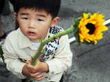 A child joins anti-nuclear power plant demonstrators