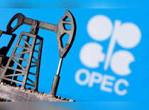 FILE PHOTO: A 3D printed oil pump jack in front of the OPEC logo
