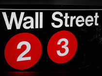 FILE PHOTO: A sign for the Wall Street subway station is seen in the financial district in New York