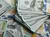 Dollar falls against commodity currencies but holds gains versus yen