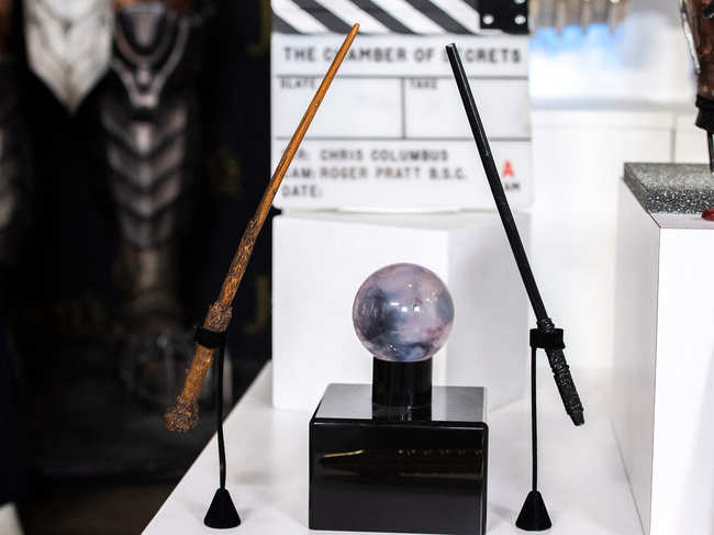 Daniel Radcliffe's Harry Potter wand from 'Harry Potter and The Gobelet of Fire' (L) and Alan Rickman's Professor Severus Snape wand from 'Harry Potter and The Prisoner of Azkaban' are seen at the preview