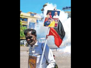 A DMK worker celebrates Udhayanidhi’s candidacy at Anna Arivalayam