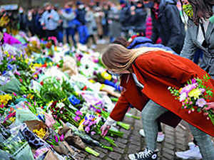 tribute flowers vigil uk afp
