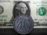 Rupee inches 9 paise higher to 72.70 against US dollar in early trade