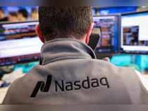 FILE PHOTO: A Nasdaq market maker works at the Nasdaq Market site in New York