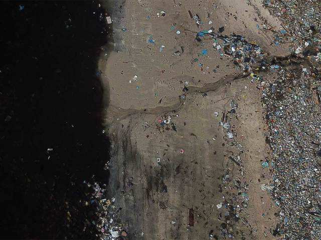 Garbage on the shore of Guanabara bay, Brazil