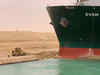 Tugs work to free giant container ship stranded in Suez Canal