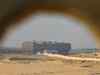 Tugs, dredgers still struggle to free ship blocking Suez Canal