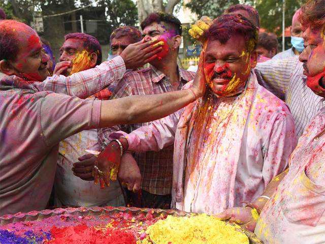 People daubed in colours
