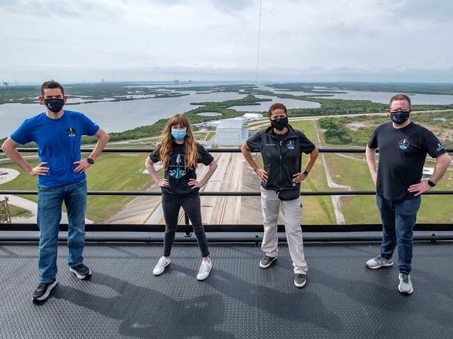 (L-R) Jared Isaacman, Hayley Arceneaux, Sian Proctor and Chris Sembroski pose for a photo at the SpaceX launch tower at NASA's Kennedy Space Center at Cape Canaveral, Florida in this handout image provided by SpaceX.