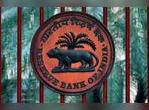 FILE PHOTO: Reserve Bank of India logo is seen at the gate of its office in New Delhi