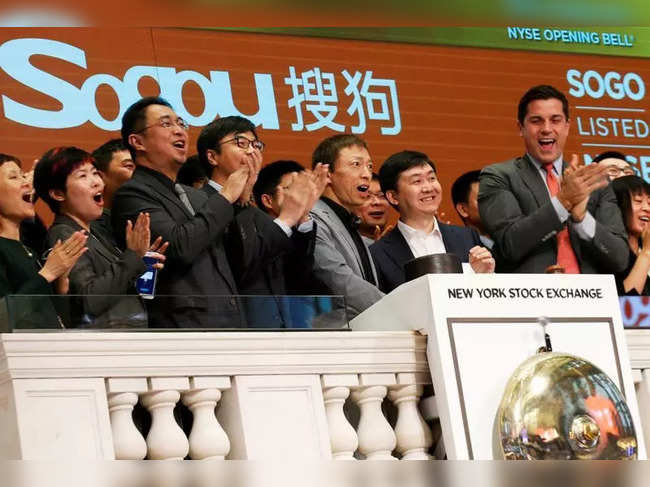 FILE PHOTO: Sogou officials ring the opening bell to celebrate their company's New York market debut in 2017