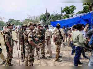Cooch Behar: Security personnel keep vigil at a polling station after Election C...