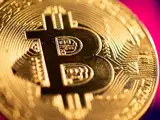 Bitcoin hits record high of $62,575