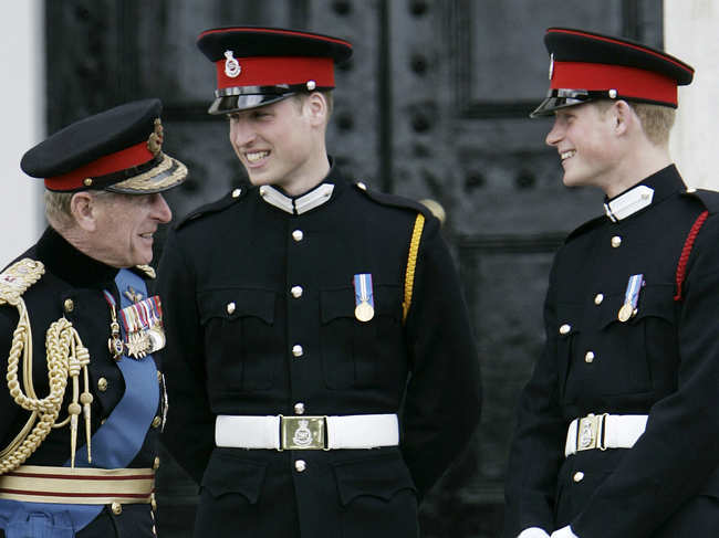 ​File photo of​ April 12, 2006: Prince Philip, left, talks to his grandsons, Prince William, centre, and Prince Harry, right, following The Sovereign's Parade at the Royal Military Academy at Sandhurst, England​.