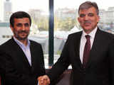 Turkey's President Gul shakes hands with Iranian President Ahmadinejad