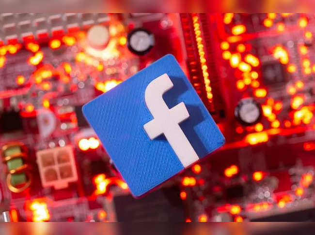 FILE PHOTO: Illustration of a 3D printed Facebook logo on a computer motherboard