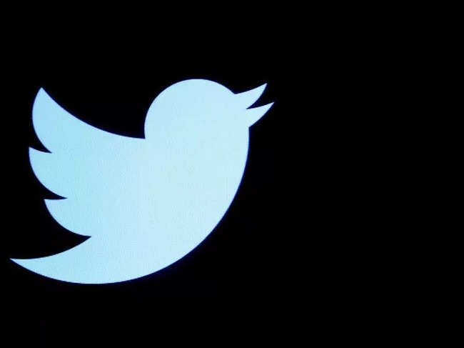 The Twitter logo displayed on a screen