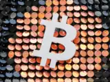 Bitcoin hits lowest since early March before retaking $50,000