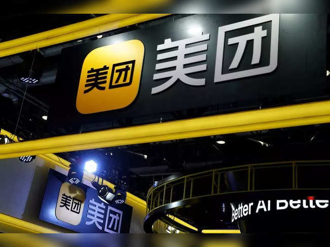 FILE PHOTO: Signs of Meituan are seen at its booth at the 2020 China International Fair for Trade in Services in Beijing
