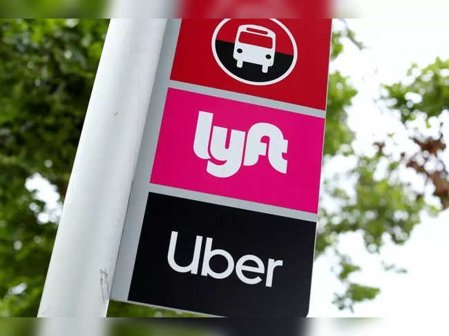 FILE PHOTO: A sign marks a rendezvous location for Lyft and Uber users at San Diego State University in San Diego