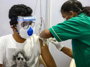 Mumbai: A medic administers the first dose of Covishield vaccine to young benefi...
