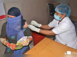 Varanasi: A beneficiary takes Covid-19 vaccine dose at a vaccination centre in V...
