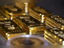 FILE PHOTO: Gold bars and coins are stacked in the safe deposit boxes room of the Pro Aurum gold house in Munich