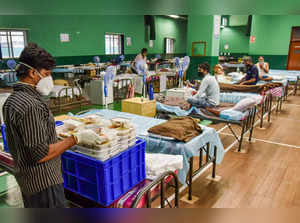 Bengaluru:  COVID-19 patients undergo treatment at a Covid Care Centre, as coron...