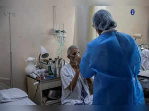 The Wider Image: As COVID ravages India, a 26-year-old doctor decides who lives and who dies