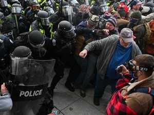 Riot police push back a crowd of supporters of US President Donald Trump after they stormed the Capitol building on January 6, 2021 in Washington, DC. Photo: AFPAFP