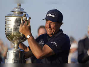 Phil Mickelson holds the Wanamaker Trophy