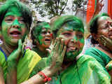 Women activists of Trinamool Congress celebrate with colours