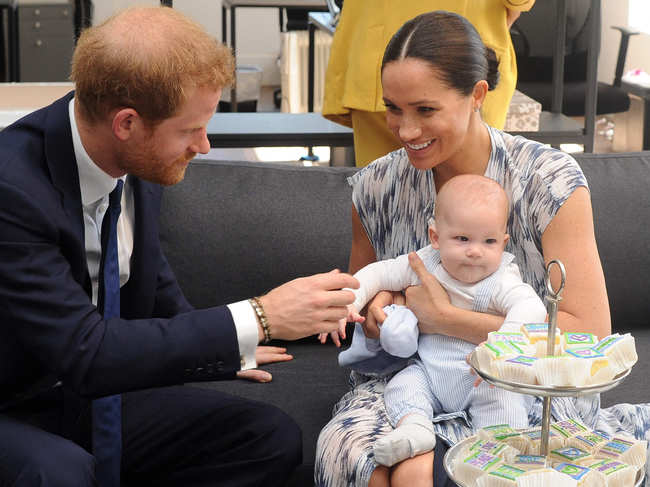 File photo of September 25, 2019: Prince Harry and his wife Meghan hold their baby son Archie as they meet with Archbishop Desmond Tutu (unseen) at the Tutu Legacy Foundation in Cape Town.